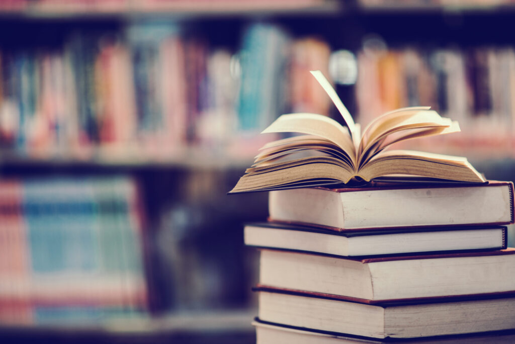 book-library-with-open-textbook-2-scaled.jpg